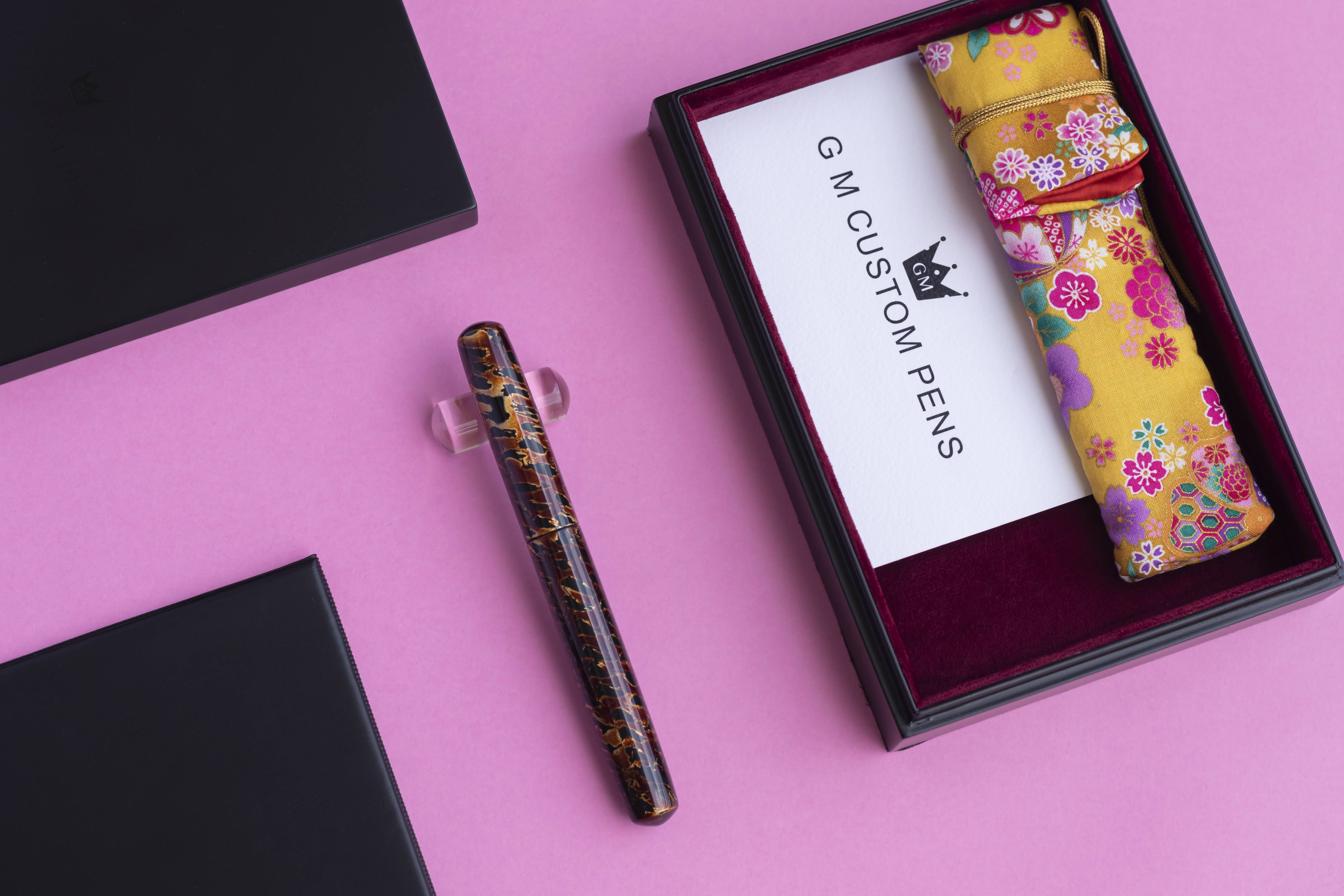 GM Custom Pens fountain pen with floral case on pink background — product photography